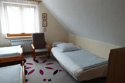 Łóżko lub łóżka w pokoju w obiekcie Mała Chatka całoroczny domek