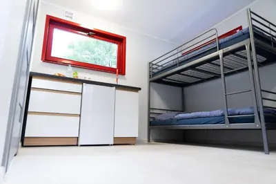 Łóżko lub łóżka w pokoju w obiekcie Osada Chmielaki