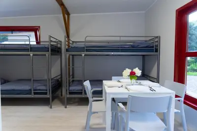 Łóżko lub łóżka w pokoju w obiekcie Osada Chmielaki