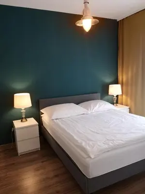 Łóżko lub łóżka w pokoju w obiekcie Apartamenty Lawendowy Zakątek 4