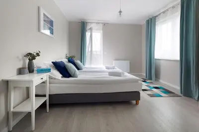 Łóżko lub łóżka w pokoju w obiekcie Apartamenty-Kudowa z pięknym widokiem i balkonem