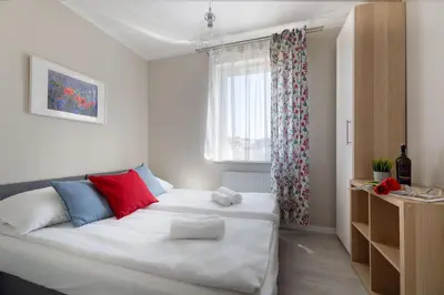 Łóżko lub łóżka w pokoju w obiekcie Apartamenty-Kudowa z pięknym widokiem i balkonem
