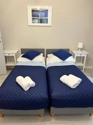 Łóżko lub łóżka w pokoju w obiekcie Apartamenty-Kudowa z pięknym widokiem i balkonem