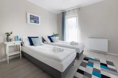 Łóżko lub łóżka w pokoju w obiekcie Apartamenty-Kudowa z pięknym widokiem i balkonem