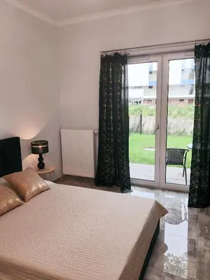 Łóżko lub łóżka w pokoju w obiekcie Na Grobli 20 Apartament z ogródkiem