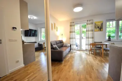 Telewizja i/lub zestaw kina domowego w obiekcie Apartament harmonic aparts