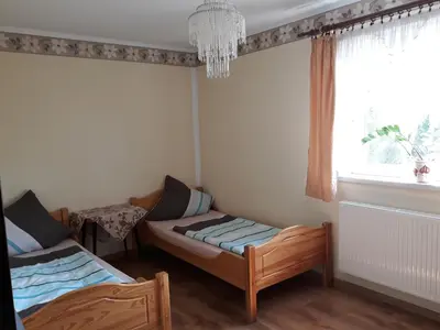 Łóżko lub łóżka w pokoju w obiekcie Pod Piramidą