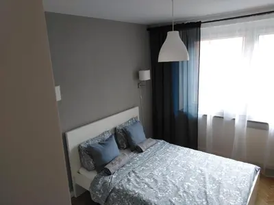 Łóżko lub łóżka w pokoju w obiekcie Apartament Wrocław przy Rynku
