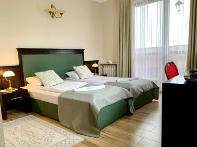 Łóżko lub łóżka w pokoju w obiekcie Nocowanie Restauracja Wenecka