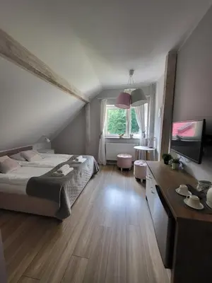 Łóżko lub łóżka w pokoju w obiekcie Apartamenty Willove Wzgórze