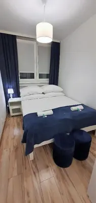 Łóżko lub łóżka w pokoju w obiekcie Apartament Łąkowa
