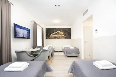 Łóżko lub łóżka w pokoju w obiekcie Hotel Stronie