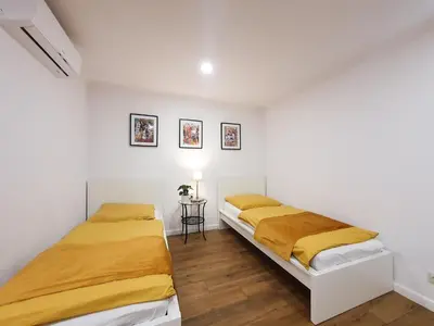 Łóżko lub łóżka w pokoju w obiekcie Apartamenty Toszeckie