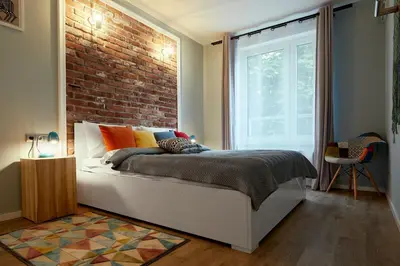 Łóżko lub łóżka w pokoju w obiekcie Sherlock Apartment