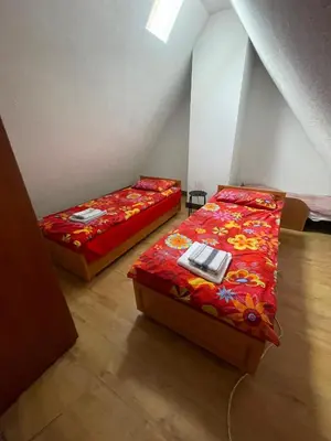 Łóżko lub łóżka w pokoju w obiekcie Apartament pod Stożkiem