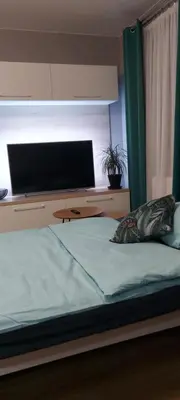 Łóżko lub łóżka w pokoju w obiekcie kawalerka na Piastowskim