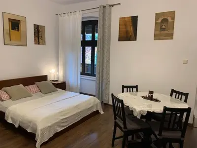 Łóżko lub łóżka w pokoju w obiekcie Kamienica na Krakowskiej 120 m2