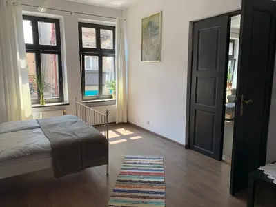 Łóżko lub łóżka w pokoju w obiekcie Kamienica na Krakowskiej 120 m2