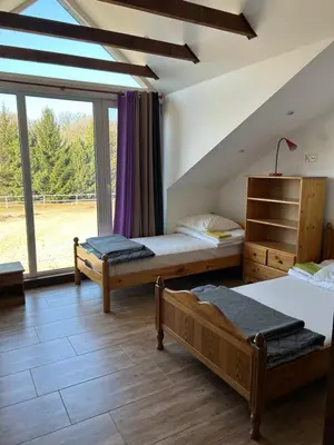 Łóżko lub łóżka w pokoju w obiekcie Ośrodek Agroturystyczny Przystanek Koński Dwór