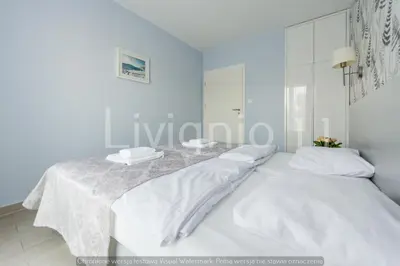 Łóżko lub łóżka w pokoju w obiekcie Apartament Czarna Góra Sienna LIV