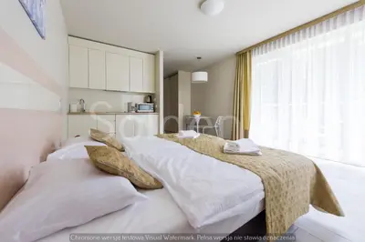 Łóżko lub łóżka w pokoju w obiekcie Apartament Czarna Góra Sienna SOL