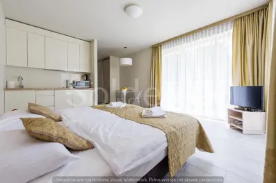 Łóżko lub łóżka w pokoju w obiekcie Apartament Czarna Góra Sienna SOL