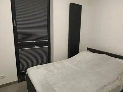 Łóżko lub łóżka w pokoju w obiekcie Apartamenty Dworcowa 45