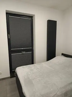 Łóżko lub łóżka w pokoju w obiekcie Apartamenty Dworcowa 45