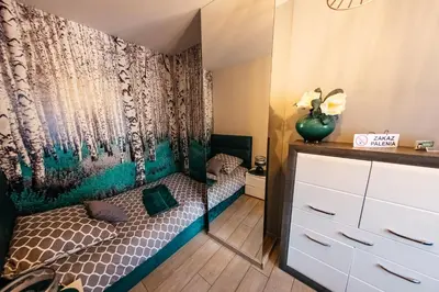 Łóżko lub łóżka w pokoju w obiekcie Apartamenty Długa 7