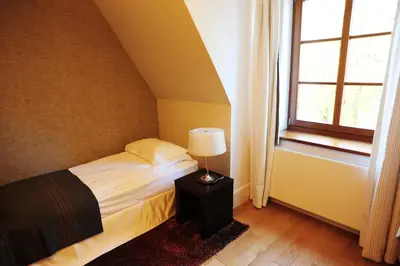 Łóżko lub łóżka w pokoju w obiekcie Hotel Zamek Lubliniec