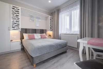 Łóżko lub łóżka w pokoju w obiekcie pokoje goscinne i apartamenty Margaret