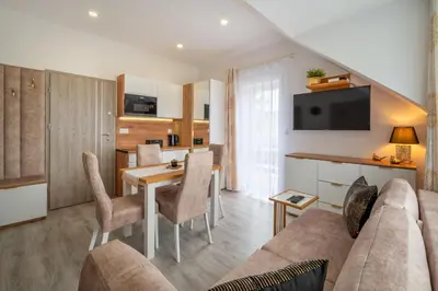 Telewizja i/lub zestaw kina domowego w obiekcie pokoje goscinne i apartamenty Margaret