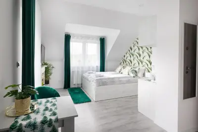 Łóżko lub łóżka w pokoju w obiekcie pokoje goscinne i apartamenty Margaret