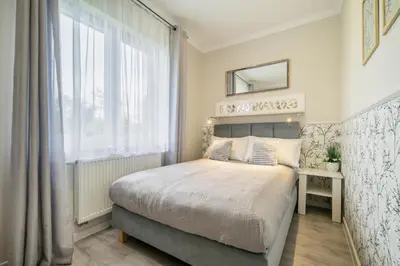 Łóżko lub łóżka w pokoju w obiekcie pokoje goscinne i apartamenty Margaret