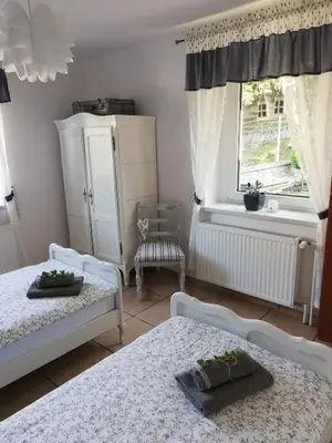 Łóżko lub łóżka w pokoju w obiekcie Apartament HANYSEK