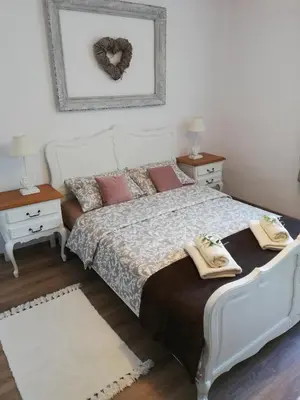 Łóżko lub łóżka w pokoju w obiekcie Apartament HANYSEK