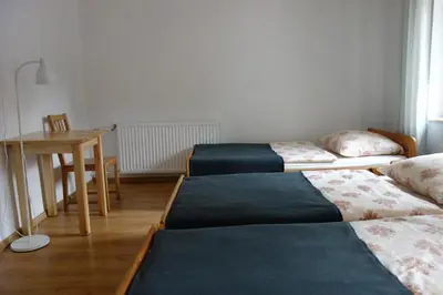 Łóżko lub łóżka w pokoju w obiekcie Dom Gościnny Tatra Nova