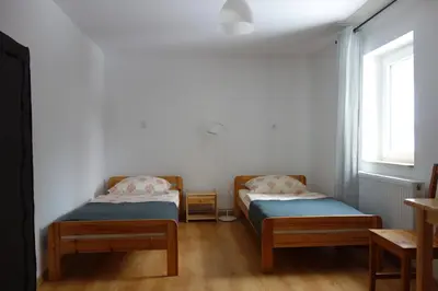 Łóżko lub łóżka w pokoju w obiekcie Dom Gościnny Tatra Nova