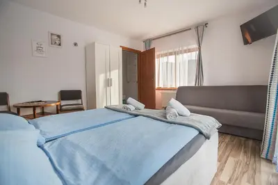 Łóżko lub łóżka w pokoju w obiekcie Nad Cedronem