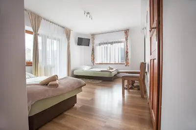 Łóżko lub łóżka w pokoju w obiekcie Nad Cedronem