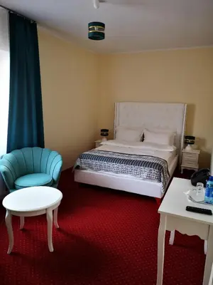Łóżko lub łóżka w pokoju w obiekcie Hotel i Restauracja Admirał