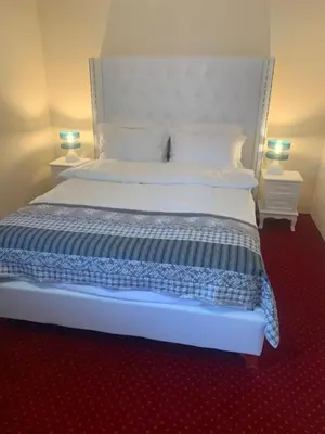 Łóżko lub łóżka w pokoju w obiekcie Hotel i Restauracja Admirał