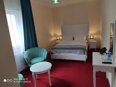 Łóżko lub łóżka w pokoju w obiekcie Hotel i Restauracja Admirał