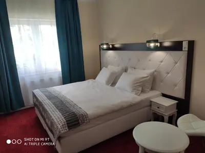 Łóżko lub łóżka w pokoju w obiekcie Hotel i Restauracja Admirał