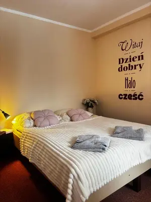 Łóżko lub łóżka w pokoju w obiekcie Gościniec Wstąp TU