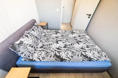 Łóżko lub łóżka w pokoju w obiekcie Apartament Piano Centrum
