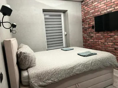 Łóżko lub łóżka w pokoju w obiekcie Raciborska Royal Apartment - miejsce parkingowe na parkingu strzeżonym