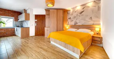 Łóżko lub łóżka w pokoju w obiekcie Apartamenty Grodowa 2