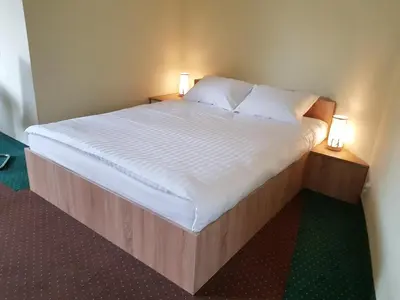 Łóżko lub łóżka w pokoju w obiekcie Apartamenty Grodowa 2
