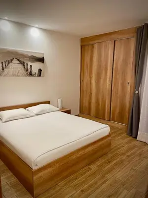 Łóżko lub łóżka w pokoju w obiekcie Apartamenty Grodowa 2